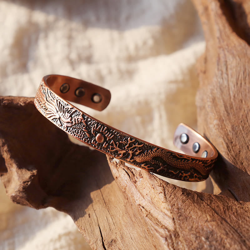 Dragon Phoenix Copper Cuff Bracelet – Copper cuff on weathered wood, mythological relief with inner magnets, Harmony