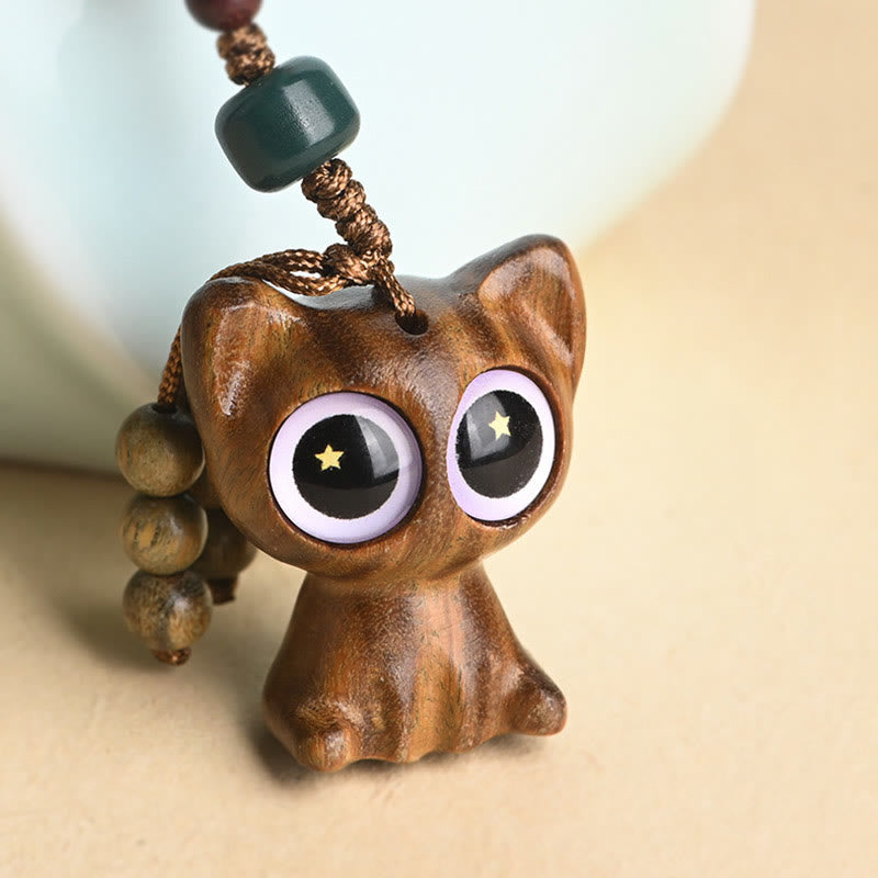 Green Sandalwood Key Chain – artistic shadow play, koi fish and lucky cat silhouette