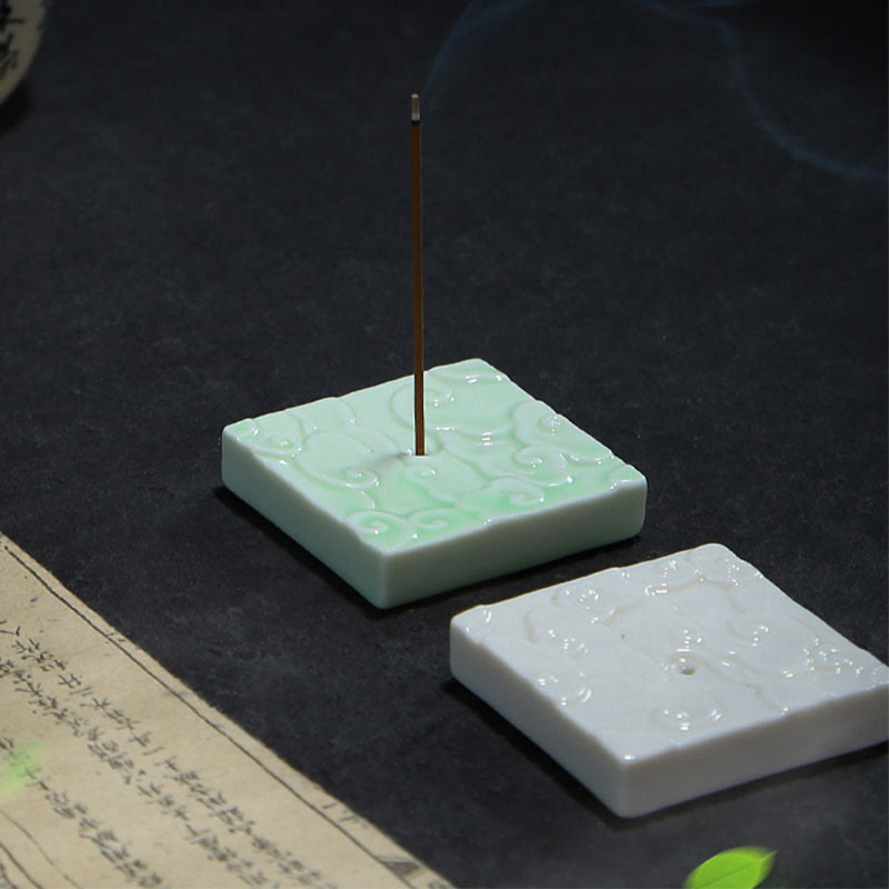 Mini Auspicious Clouds Ceramic Incense Burner – green square holder with lit incense and smoke trail on dark table, ceramic incense holder