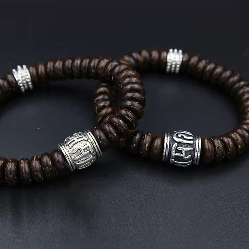 Om Mani Padme Hum Coconut Shell Bracelet – stacked pair on dark surface, beaded duo