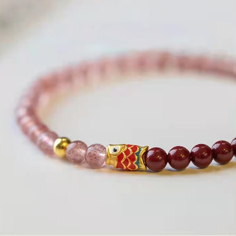 Strawberry Quartz Koi Bracelet – wrist close-up showing bracelet stretch and comfort fit