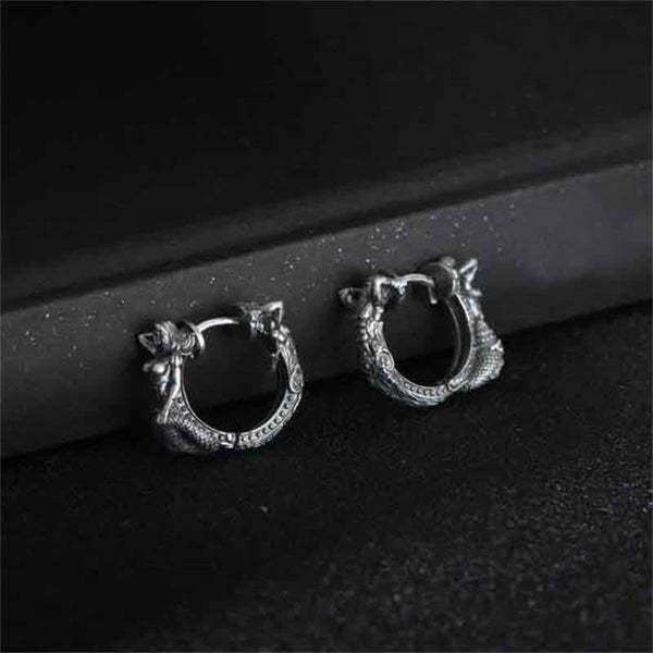 Sterling Silver Dragon Hoop Earrings – oxidized dragon head huggie hoops on black velvet stand, mythical serpent design