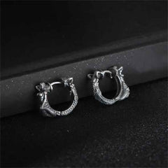 Sterling Silver Dragon Hoop Earrings – oxidized dragon head huggie hoops on black velvet stand, mythical serpent design