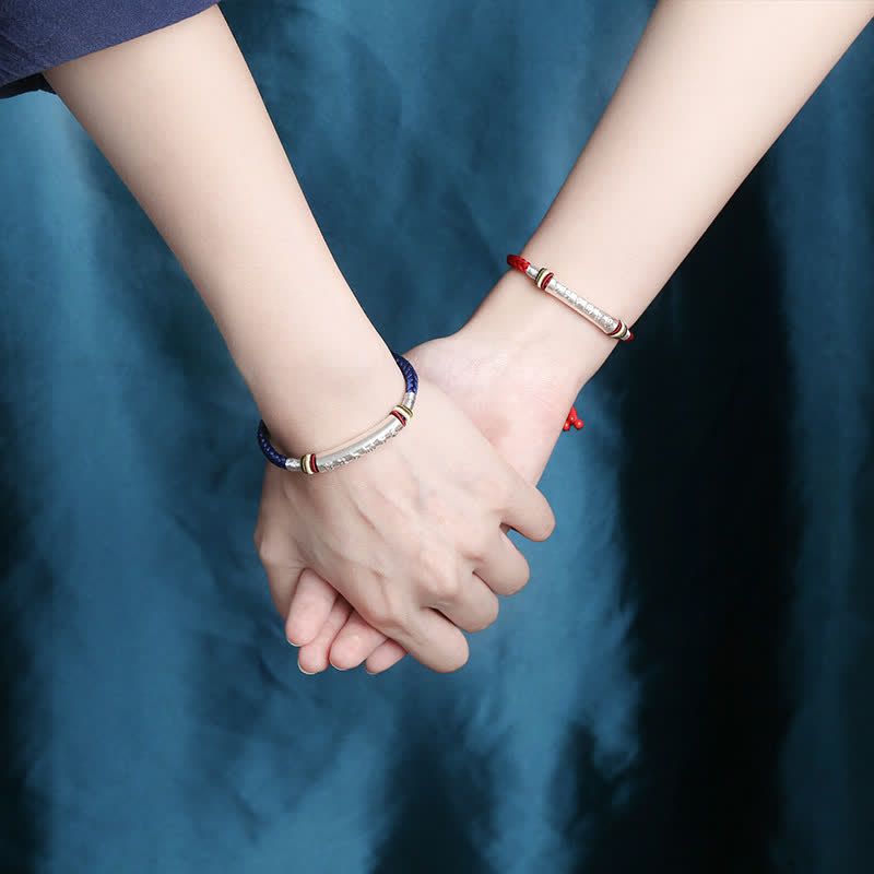 Om Mani Padme Hum Red String Bracelet – Red and blue cords on clasped hands, couples matching set