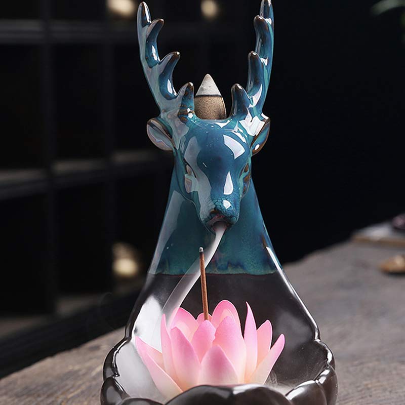 Little Deer Ceramic Lotus Incense Burner – Close-up turquoise deer head with marbled glaze and pink lotus, dual incense slots