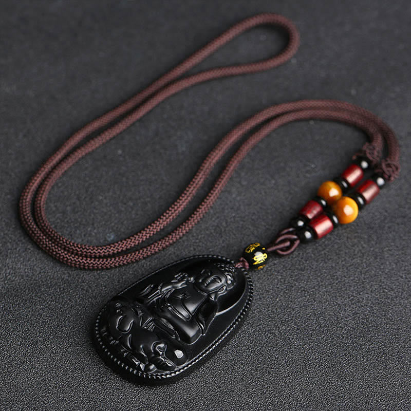 Chinese Zodiac Buddha Black Obsidian Necklace – full necklace layout showing obsidian pendant with amber and red wooden beads on dark cord, S-curve drape, zodiac guardian