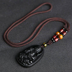 Chinese Zodiac Buddha Black Obsidian Necklace – full necklace layout showing obsidian pendant with amber and red wooden beads on dark cord, S-curve drape, zodiac guardian