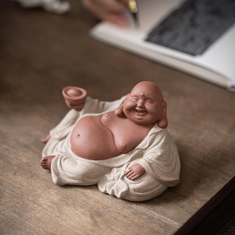 Laughing Buddha Clay Statue – size comparison with hand holding the figurine, compact collectible