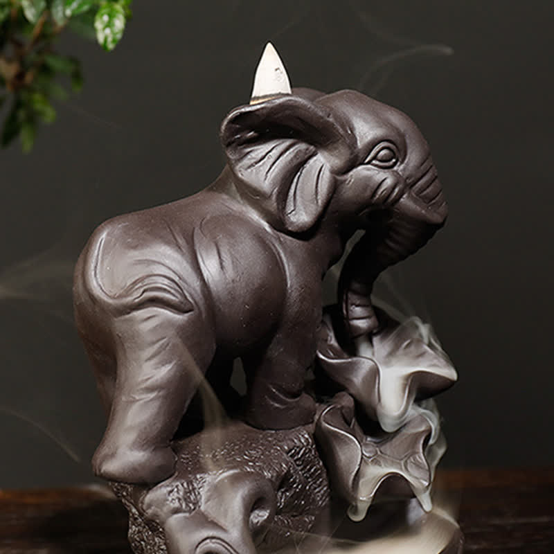 Gold-Accented Elephant Incense Burner – Side view with ornate saddle and headpiece, smoke waterfall on dark wooden surface