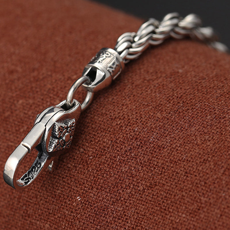 Silver Dorje Bracelet – gothic motif clasp with oxidized finish on brown fabric, men's silver chain