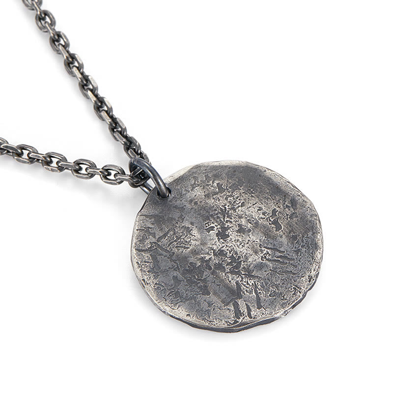 Sterling Silver Yin Yang Necklace – Close-up of round hammered disc pendant with oxidized artisan finish