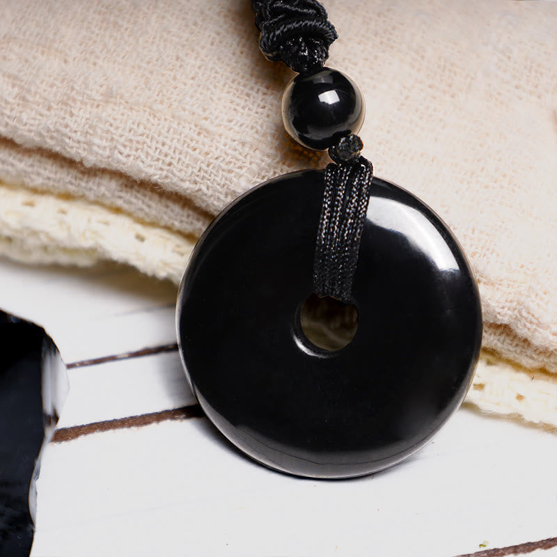 Lucky Coin Pendant Healing Crystal Gemstone Necklace – Black obsidian pi disc pendant with reflective polish on black cord