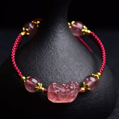 Strawberry Crystal PiXiu Charm Lucky Red String Bracelet – front view with pink crystal beads and gold spacers on black stand, feng shui good luck jewelry