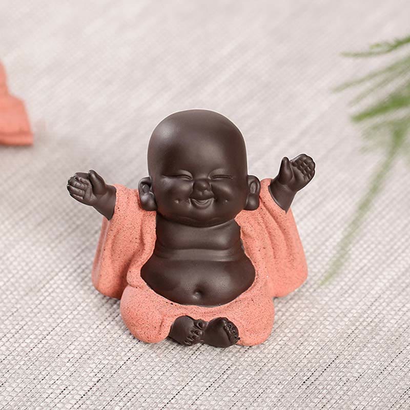 Laughing Buddha Purple Clay Maitreya Statue – handcrafted clay Buddha figurine with smooth dark body and granular salmon robe, raised-arm celebration pose