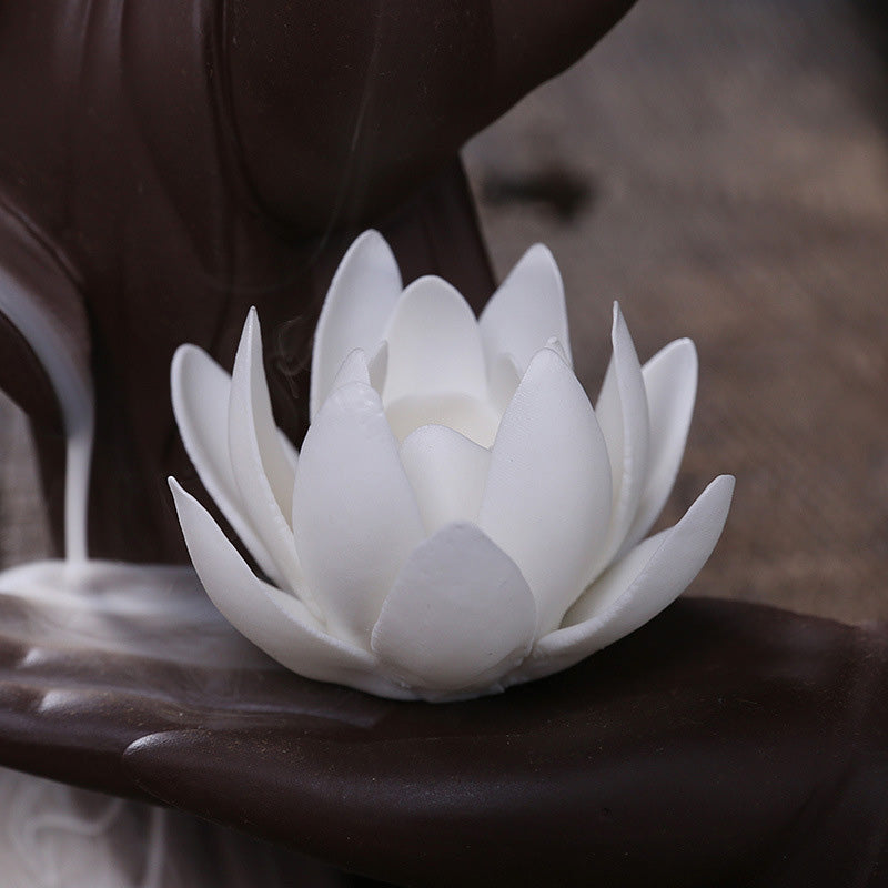 Tibetan Lotus Incense Burner – Buddha hand with lotus and stick incense on wood, healing decor