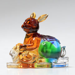 12 Zodiac Liuli Dragon Art Piece – Seated zodiac rabbit with gold ingots on crystal platform, prosperity decor