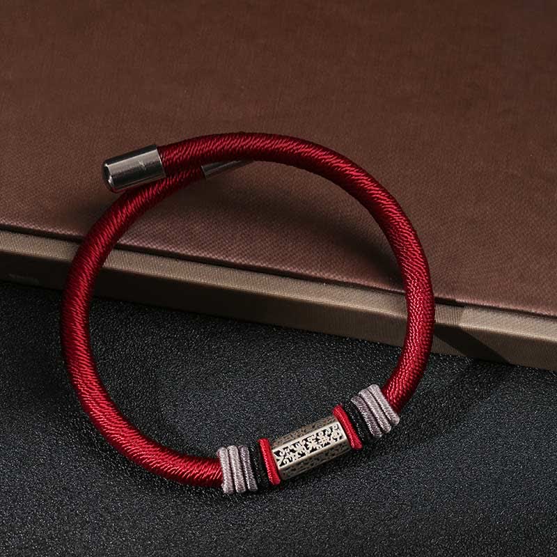 Om Mani Padme Hum Red Bracelet – Relaxed oval on dark leather, silver mantra bead with wrapped cord accents, protection bracelet