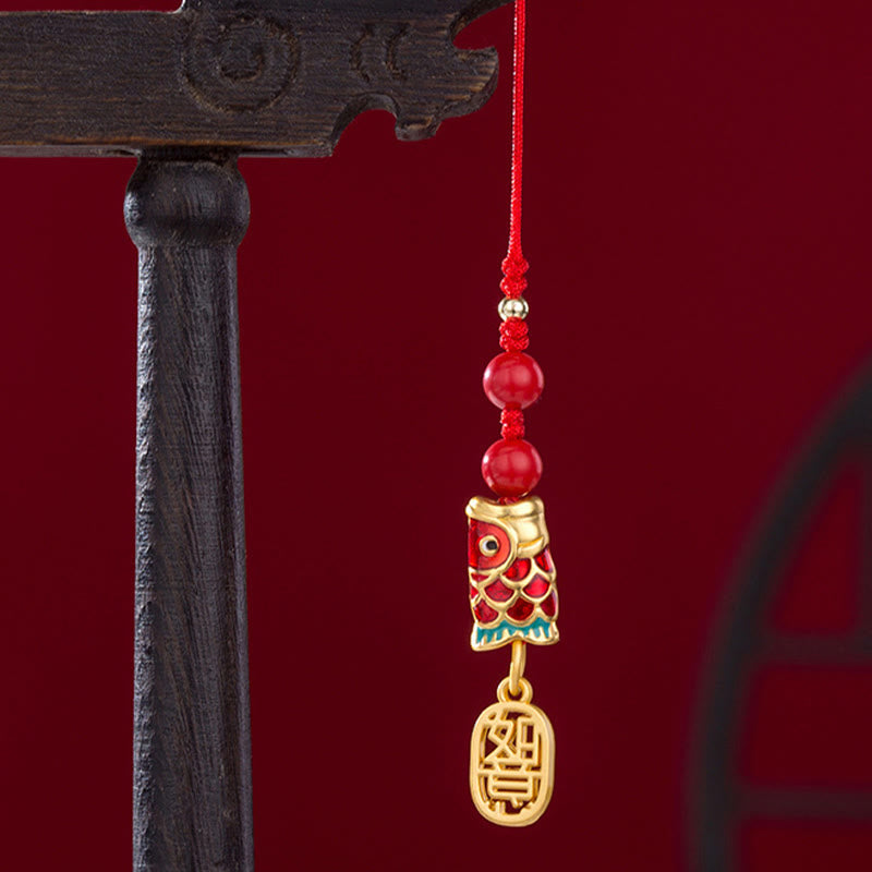 Koi Fish Cinnabar Ruyi Phone Charm – side angle showing depth of cinnabar koi carving and ruyi shape, phone charm