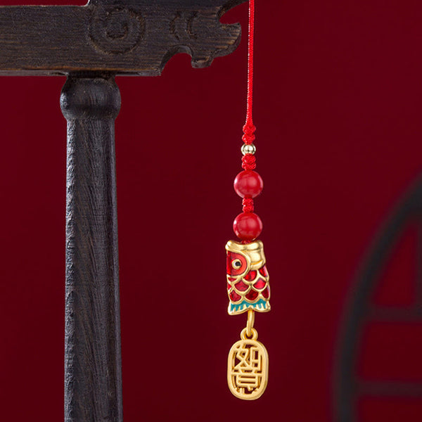 Koi Fish Cinnabar Ruyi Phone Charm – side angle showing depth of cinnabar koi carving and ruyi shape, phone charm