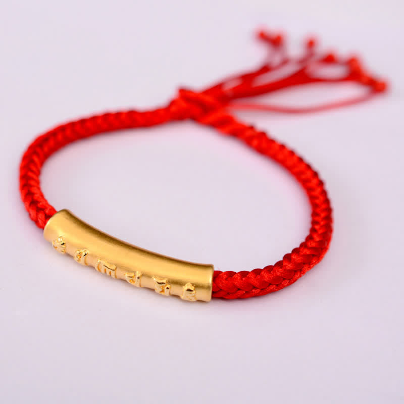 Om Mani Padme Hum Red String Bracelet – Red cord with gold-tone mantra cylinder, white background