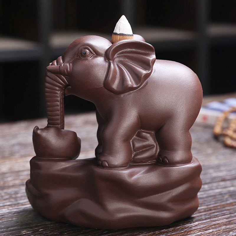 Elephant Purple Clay Incense Burner – Three-quarter view with incense cone on elephant back, ceramic incense holder