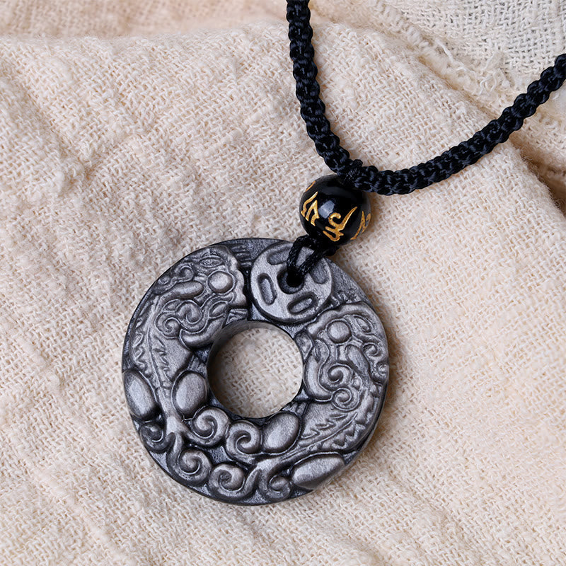 Silver Sheen Obsidian Double PiXiu Necklace – Obsidian PiXiu disc on beige fabric with gold bead, spiritual necklace