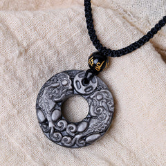 Silver Sheen Obsidian Double PiXiu Necklace – Obsidian PiXiu disc on beige fabric with gold bead, spiritual necklace