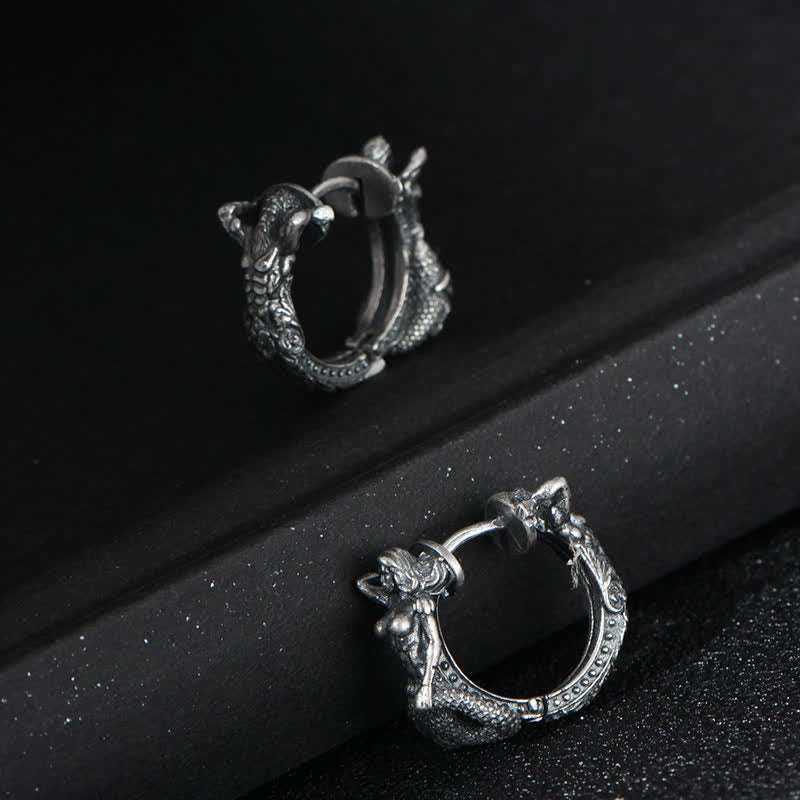 Sterling Silver Dragon Hoop Earrings – hinged dragon huggie hoops on velvet display rods, antiqued silver finish, bold