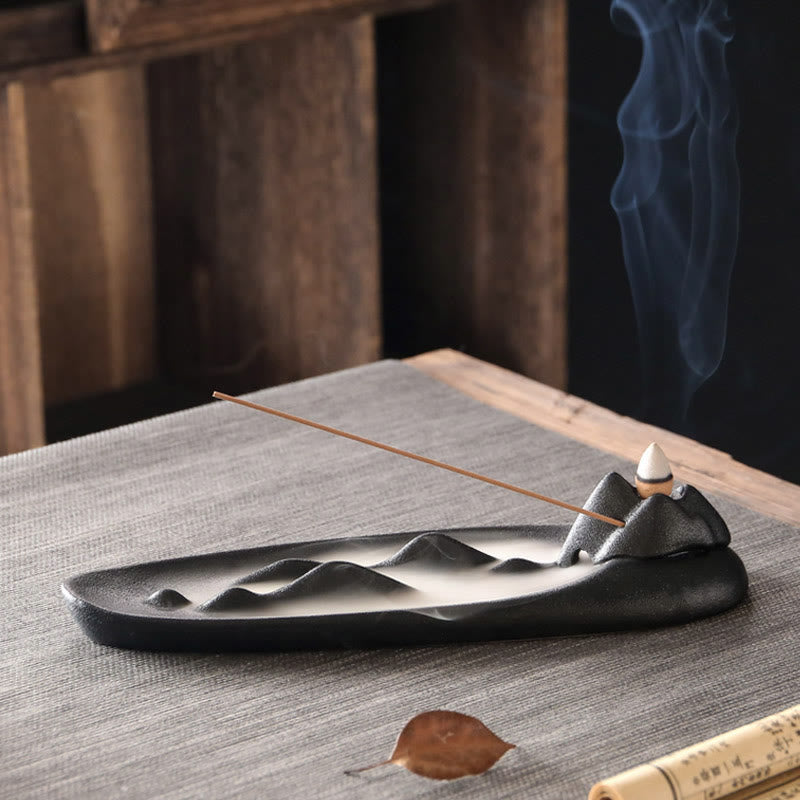 Double Koi Fish Mountain Incense Burner - black mountain burner with cone and stick incense lit