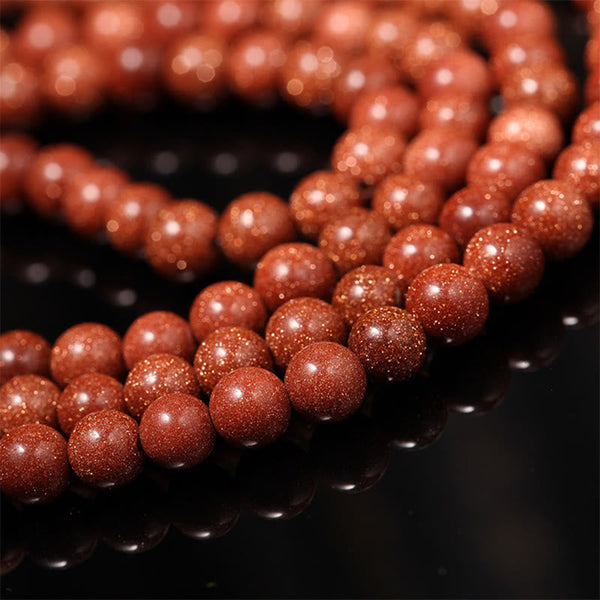 Goldstone Mala Bracelet – close-up goldstone bead strands showing sparkle texture, mala beads