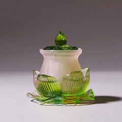 Feng Shui Lotus Liuli Crystal – white-pink lidded jar on green lotus base, zen decor