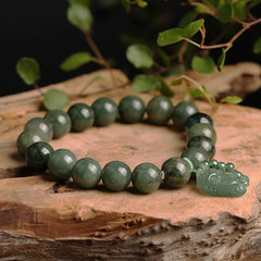 Tibetan Jade PiXiu Prosperity Bracelet – Green jade beads on natural wood slice with foliage, zen wealth bracelet