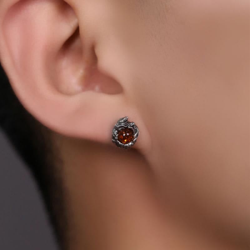 Sterling Silver Amber Dragon Earring – cognac amber stud on ear against black, dragon claw prongs, Fantasy