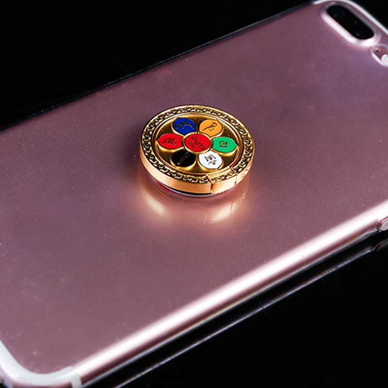 Om Mani Padme Hum Phone Ring Holder – Gold mantra ring on phone case with colored segments, smartphone stand