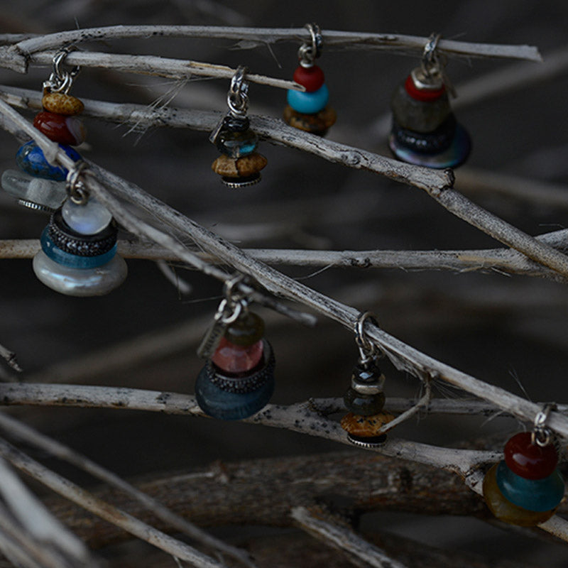 Zen Cairn Crystal Pendant – colorful beaded charms hanging from natural twigs, handmade jewelry display