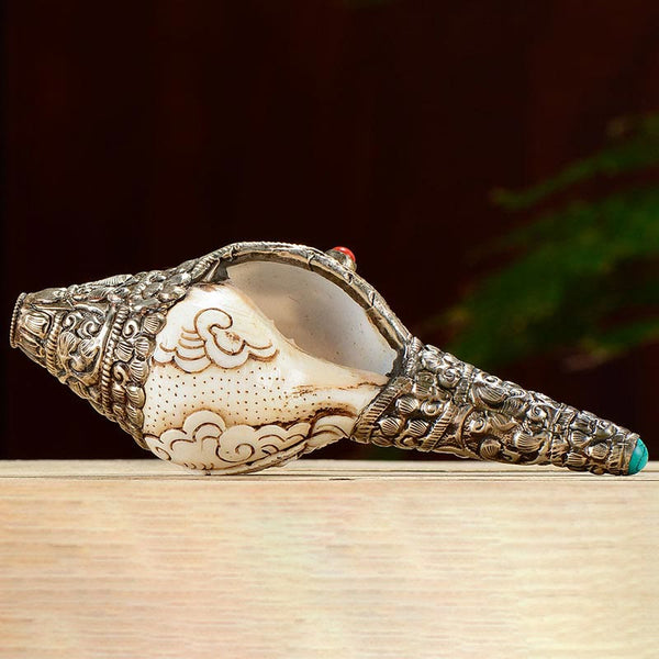 Engraved Shankha Positive Conch – monk robes draped behind conch display, monastic authenticity scene