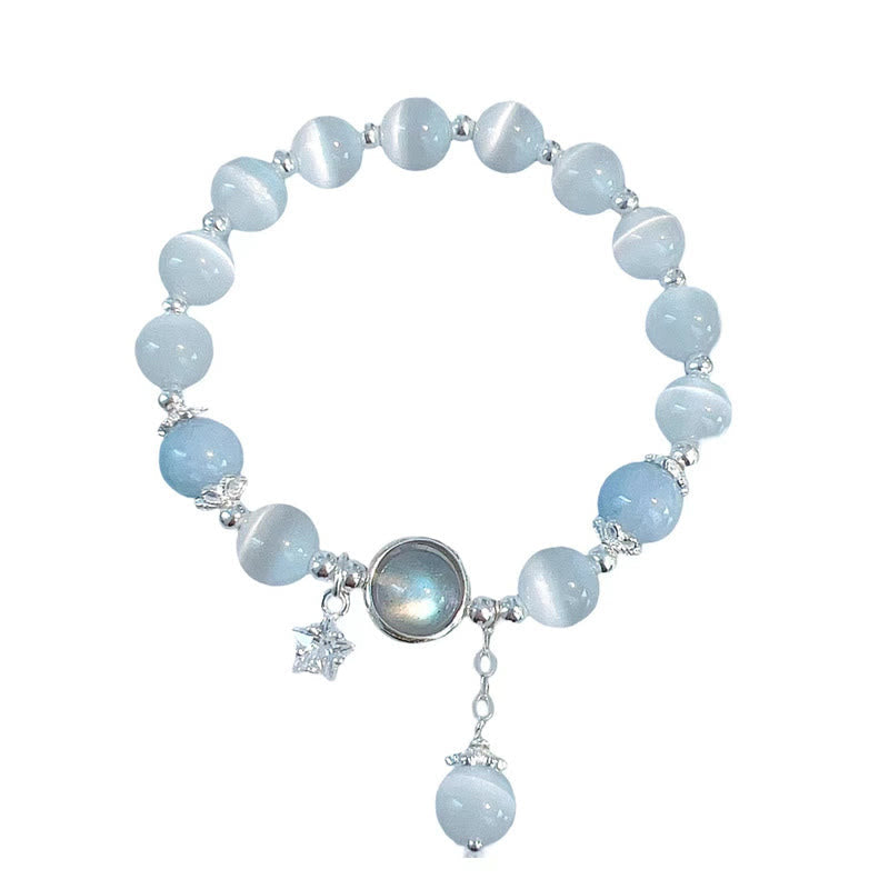 Cat's Eye Moonstone Butterfly Bracelet – Pale blue white cat's eye beads with moonstone center star charm and butterfly dangle on pure white background, product shot