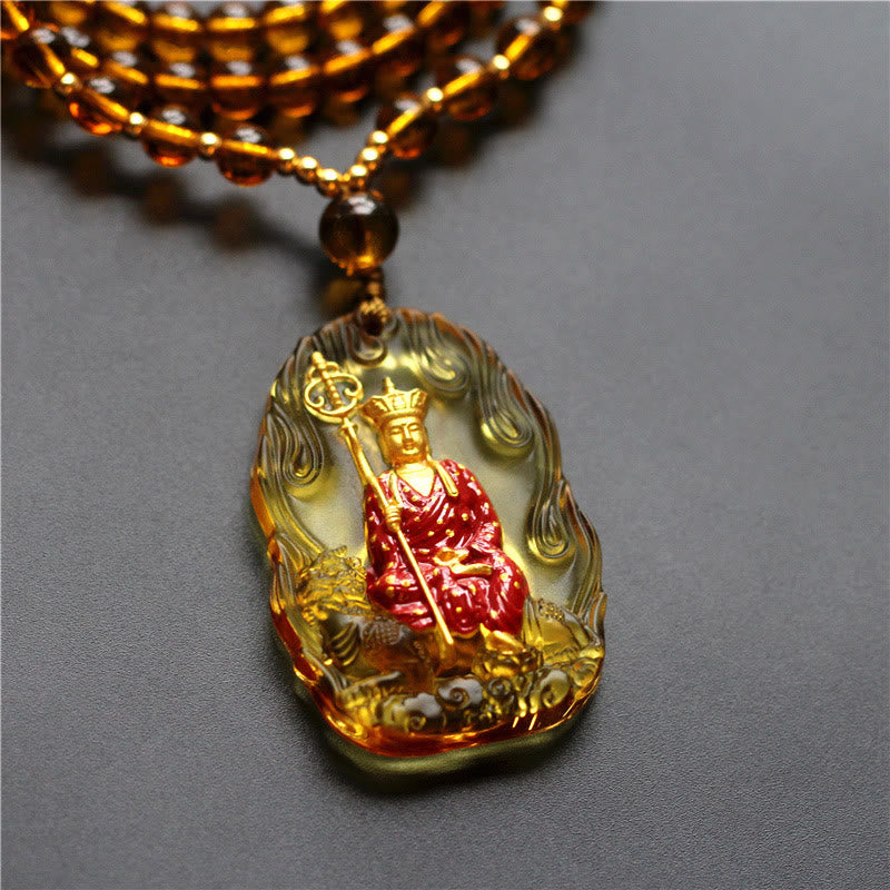 Ksitigarbha Buddha Liuli Crystal Necklace – Handcrafted liuli glass Buddha charm with warm golden hue, meditation accessory