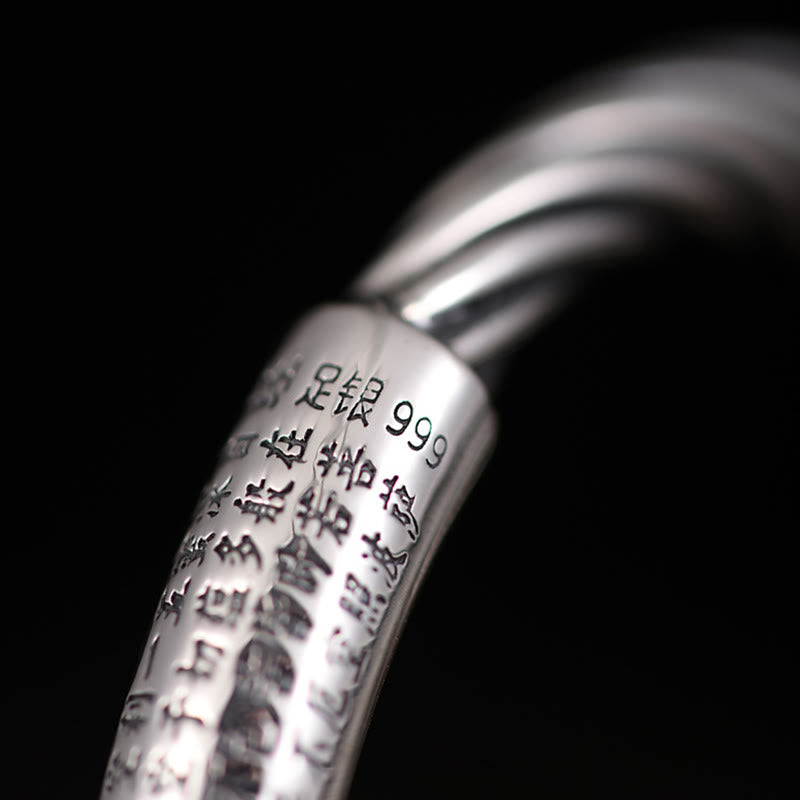 Tibetan Heart Sutra Cuff Bracelet – macro detail of 999 silver hallmark and sutra engraving on black, silver purity