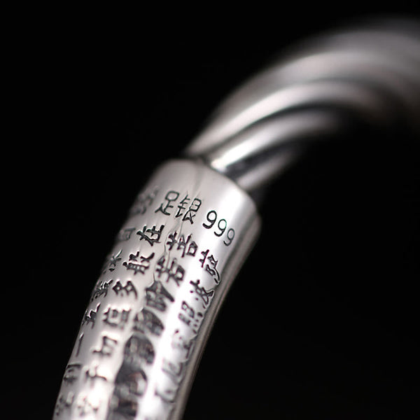 Tibetan Heart Sutra Cuff Bracelet – macro detail of 999 silver hallmark and sutra engraving on black, silver purity