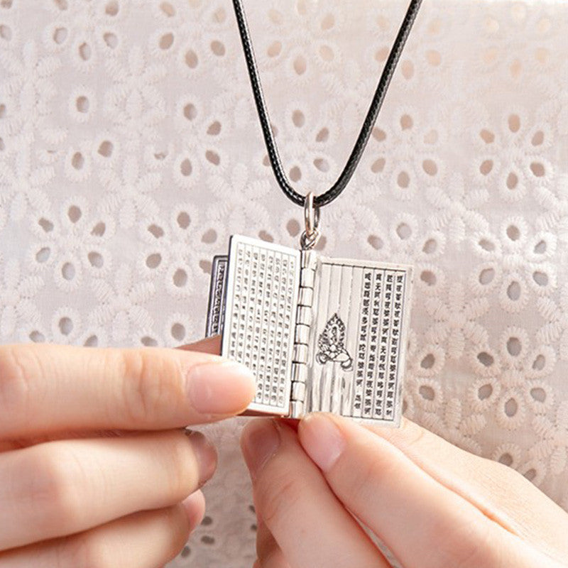 Sterling Silver Heart Sutra Pendant – Polished book locket with lotus flower engraving, devotion
