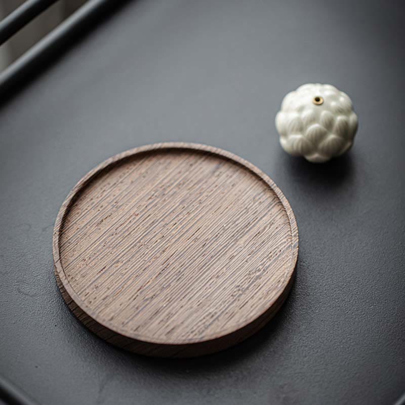 Ceramic Lotus Incense Burner with wooden tray on dark stone surface, modern zen decor