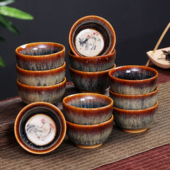 12 Zodiac Jian Zhan Teacup - stacked dozen cups with hare fur glaze and zodiac animal interiors, bamboo and tea props