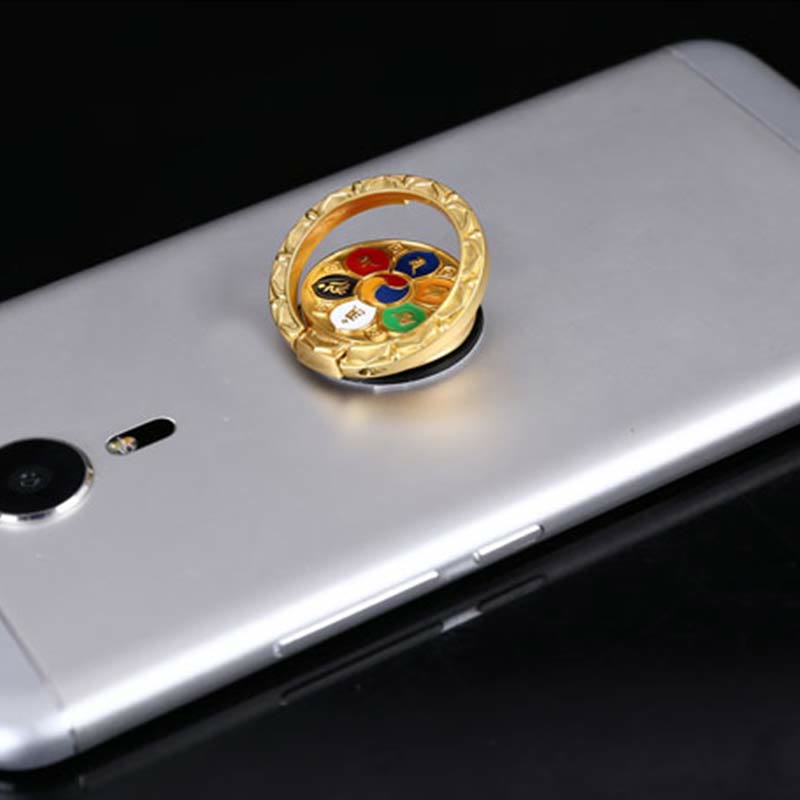 Om Mani Padme Hum Phone Ring Holder – Gold ring with Korean trigram yin-yang on silver phone, cultural grip