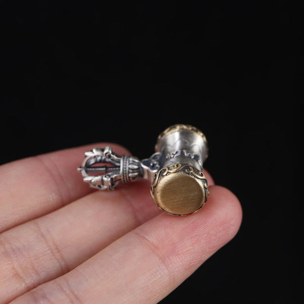 925 Silver Dorje Bell Pendant – Two-tone vajra with brass end caps and silver prongs, in-hand view