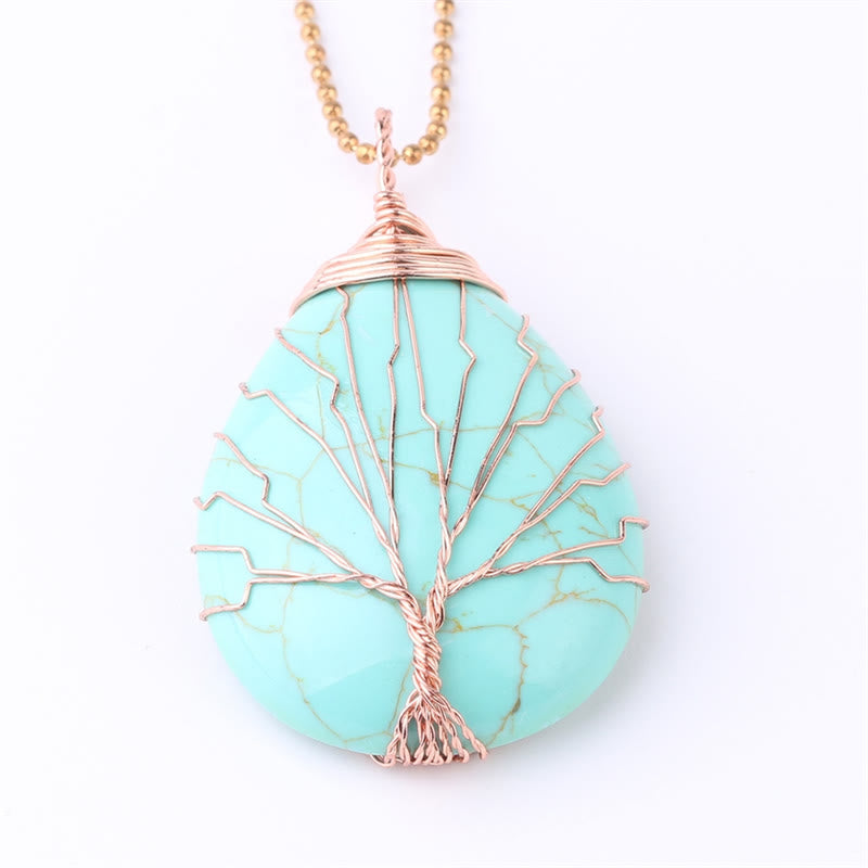 Quartz Crystal Tree of Life Necklace – turquoise blue teardrop pendant, rose gold wire tree, white background