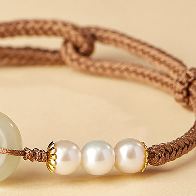 Hetian Jade Pearl Peace Buckle Bracelet – white pearl trio with gold floral caps beside jade disc, braided cord macro detail