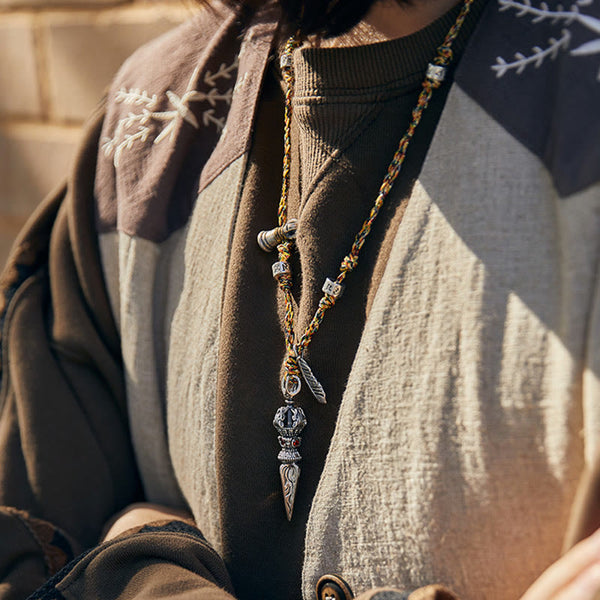 Dorje Vajra Pendant – Worn on model outdoors against stone wall, mindfulness necklace