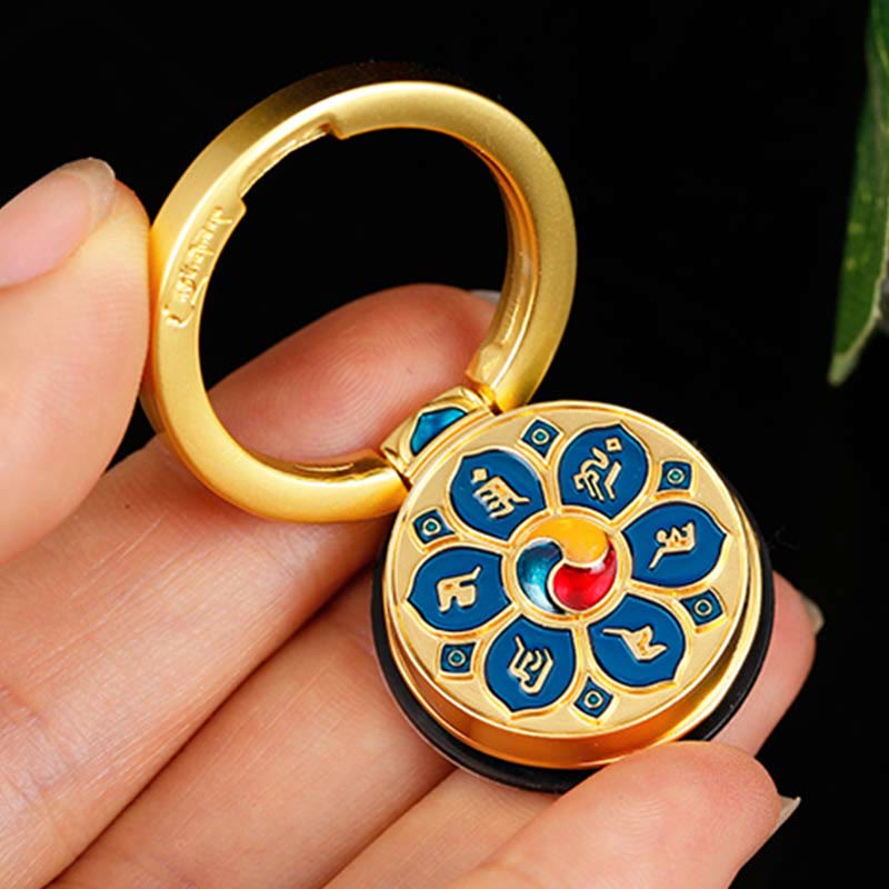 Om Mani Padme Hum Phone Ring Holder – Gold keychain with blue enamel mantra medallion, Buddhist jewelry