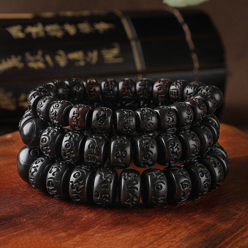 Lightning Strike Wood Bracelet – Three stacked black wood bead bracelets with Tibetan carvings, prayer bead set